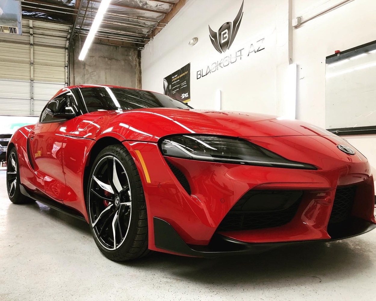 Red Toyota Supra photographed after vehicle-protection work in the Chandler shop