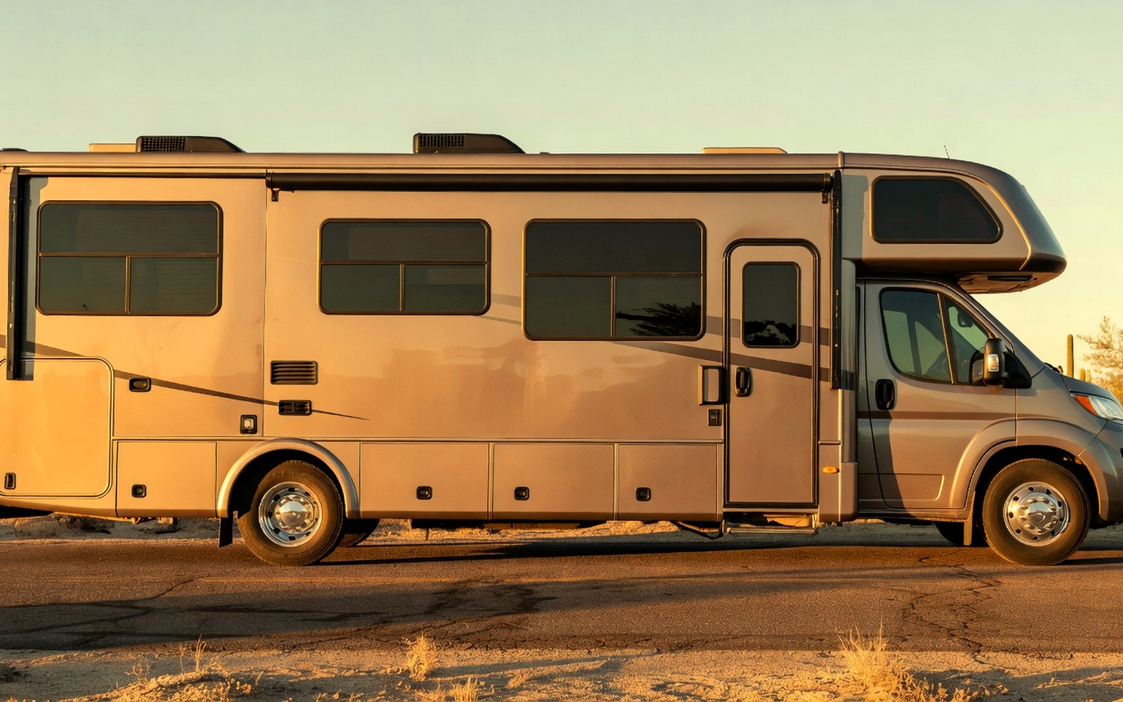 Large RV side windows with clean tint reflecting warm Arizona sunset light