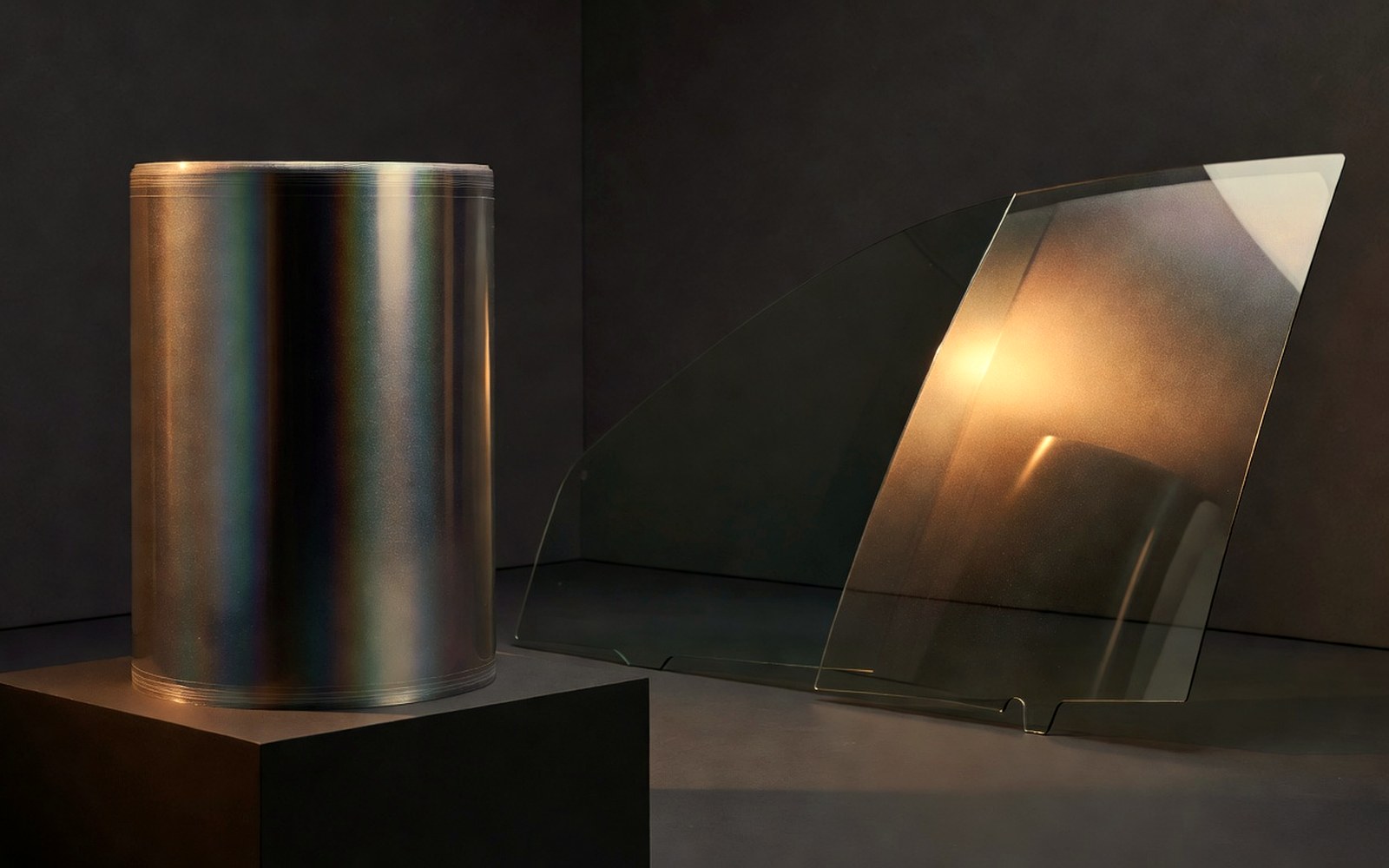 Layered warm reflections on dark automotive glass for SunTek-style film shade comparison